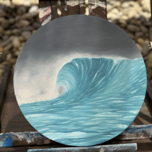 Oil ocean painting titled “Caught in the Blue” on a round canvas