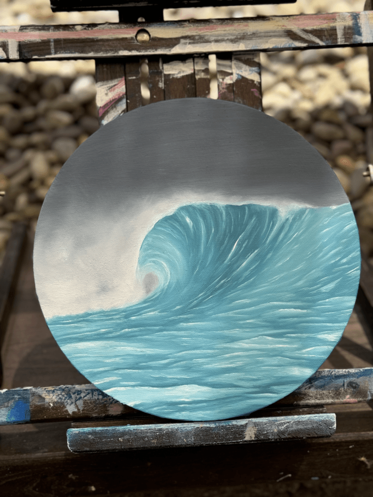 Oil ocean painting titled “Caught in the Blue” on a round canvas