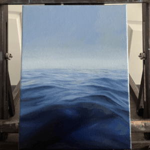 Oil ocean painting with soft waves and a pale yellow sky, titled ‘Gentle Sea’ by Olivia Catherine
