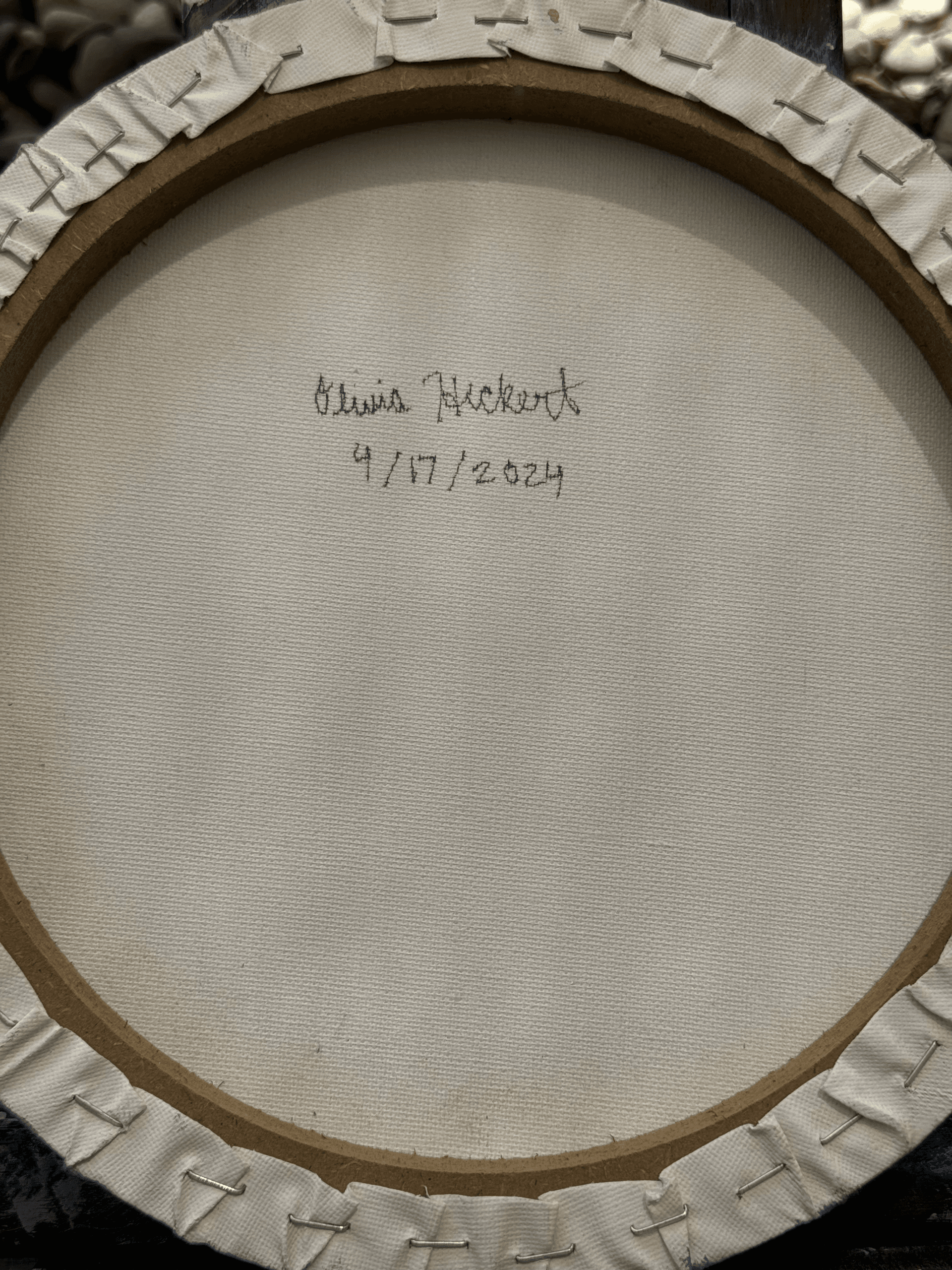 Back of the painting showing artist signature and date