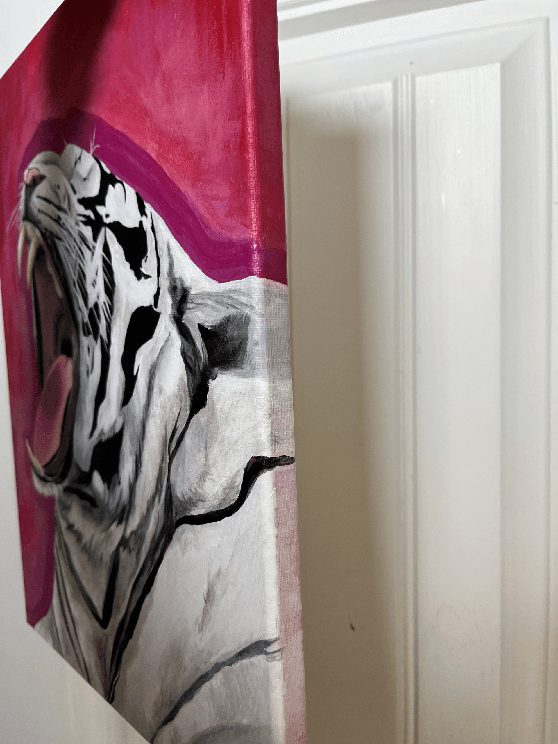 Side view of the “Roar!” acrylic painting showing the painted wrap-around edges of the canvas.