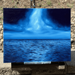 Textured ocean oil painting titled “Through the Storm” with light breaking through storm clouds