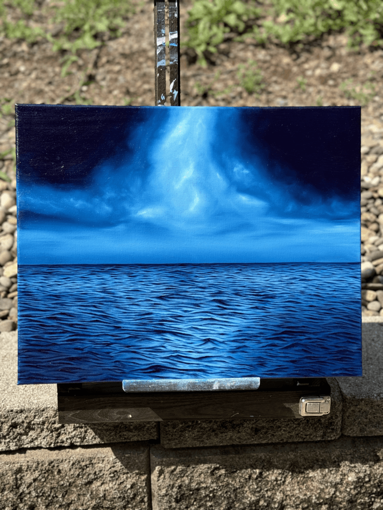 Textured ocean oil painting titled “Through the Storm” with light breaking through storm clouds